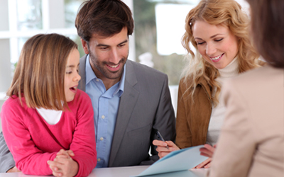 wife happily signing contract